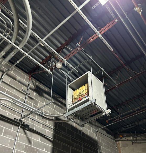 A commercial electrical box and conduit installation suspended from a ceiling by Electric Today in Indianapolis, IN.