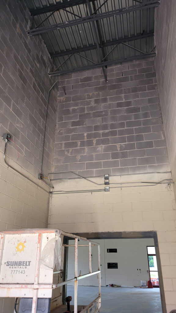 Commercial electrical conduit and box installation on a concrete wall by A.C. Electrical in Sumter, SC.