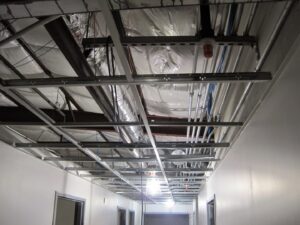 Exposed electrical conduits and wiring installed in a commercial building ceiling by Argosy Electric, Inc. in Newport News, VA