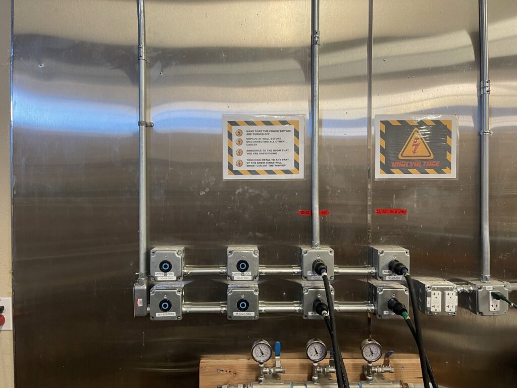 Commercial electrical conduit and wiring installation with warning signs by Gold Electric INC in Bend, OR.