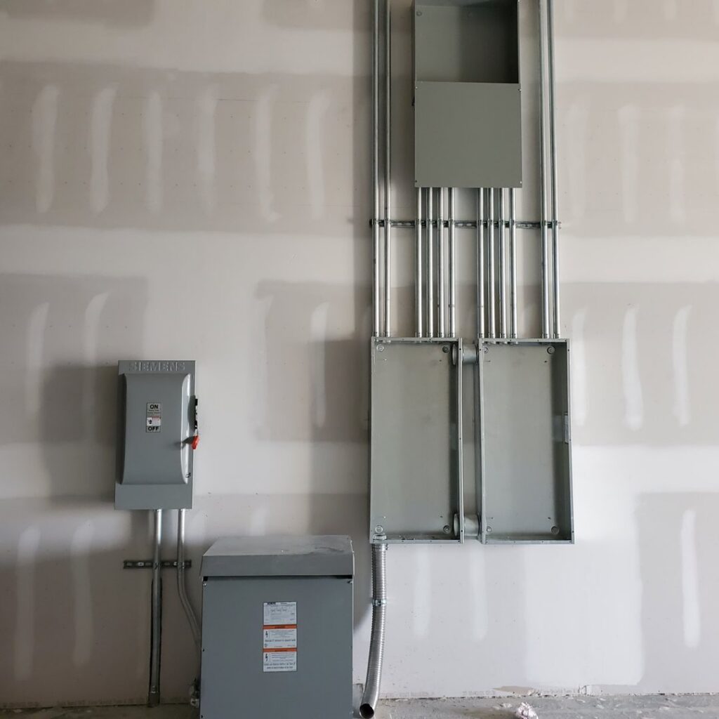Commercial electrical conduits, junction boxes, and a Siemens disconnect switch installed by York Electrical Services in York, PA.