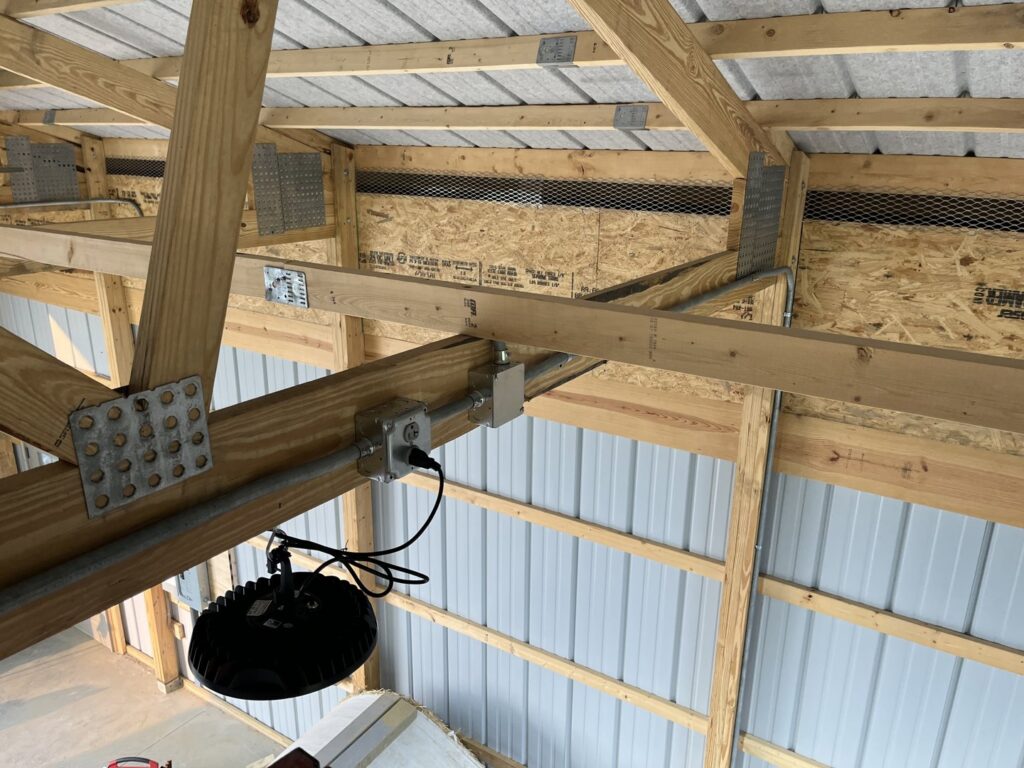 Commercial electrical conduit and high-bay lighting installation by Ardent Electric in Erie, PA.