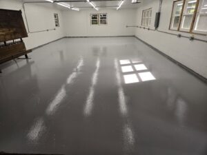 Newly installed electrical conduit and fluorescent lighting in a commercial space by Ray's Electrical and Boring Service in Elgin, IL.