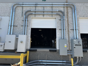 Exterior view of a commercial electrical conduit and panel installation completed by Rubio Electrical Innovations LLC in San Antonio, TX.