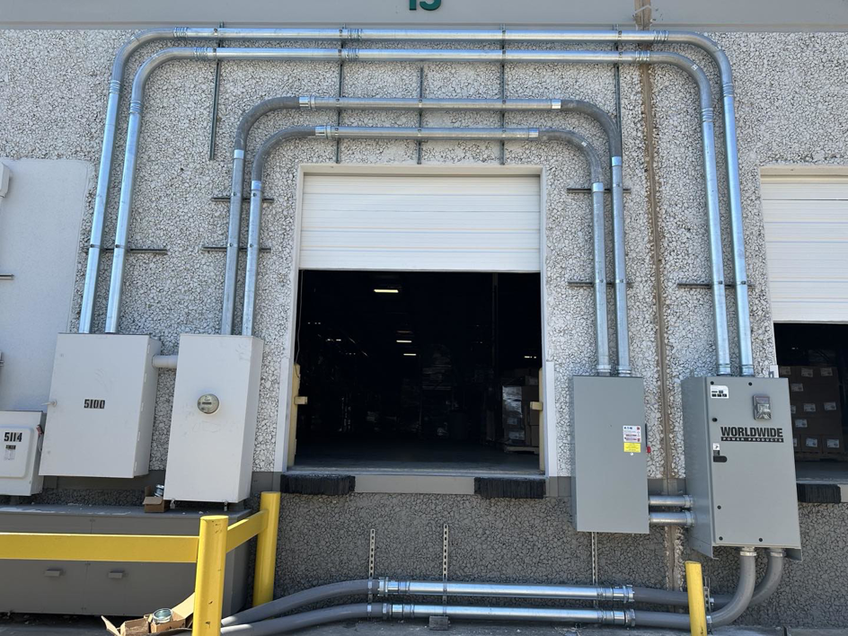 Exterior view of a commercial electrical conduit and panel installation completed by Rubio Electrical Innovations LLC in San Antonio, TX.