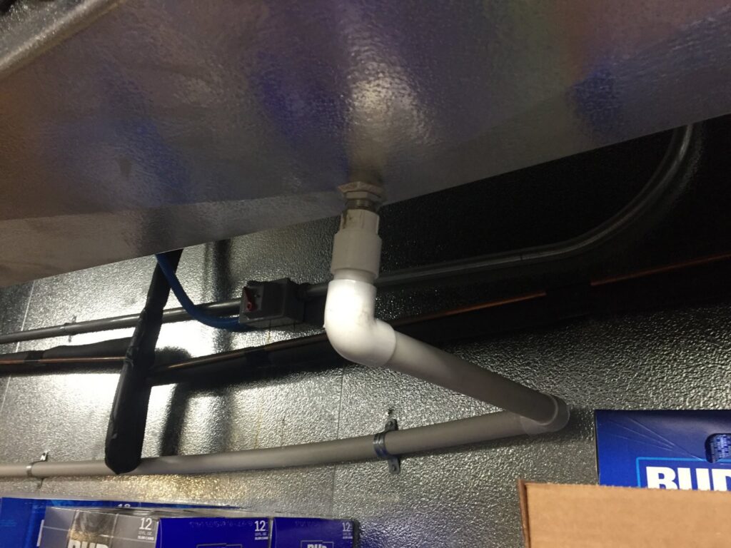 Close-up of electrical conduit and associated piping in a commercial installation by GOBE LLC in Columbia, MO.
