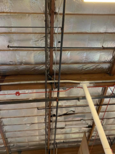 Overhead view of commercial electrical conduits and wiring installed by Olson Electrical Services in Reno, NV
