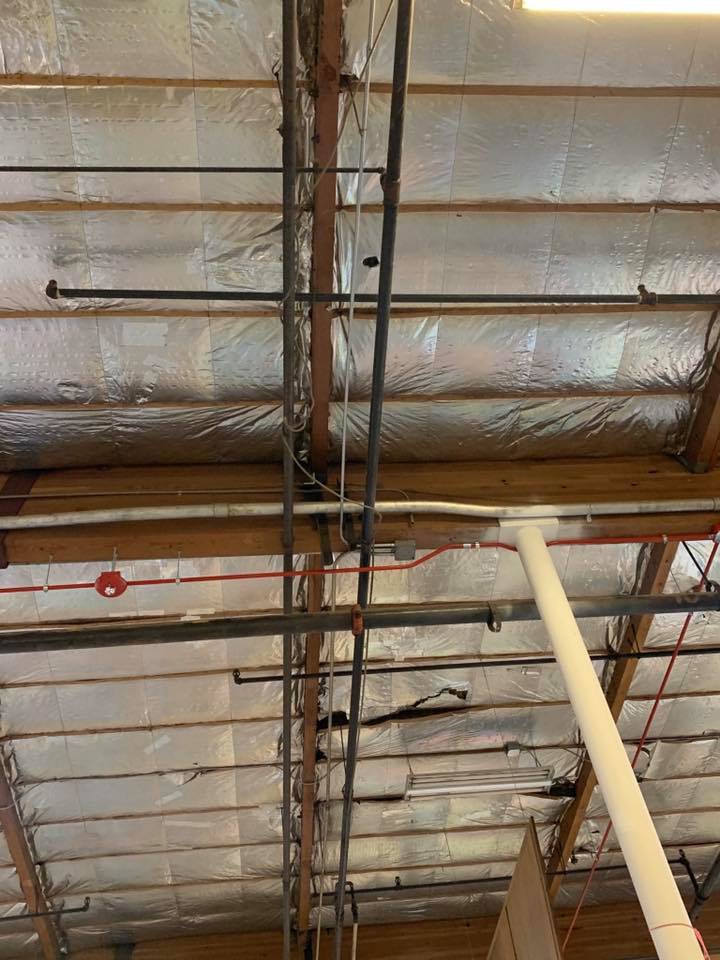 Overhead view of commercial electrical conduits and wiring installed by Olson Electrical Services in Reno, NV