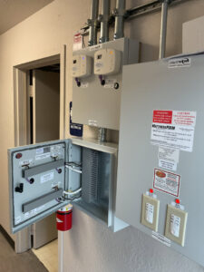 A complex commercial electrical control panel with wiring and components, indicating installation or maintenance by AAA Electrical Services in Sacramento, CA.