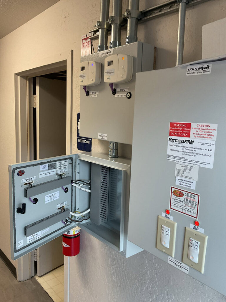 A complex commercial electrical control panel with wiring and components, indicating installation or maintenance by AAA Electrical Services in Sacramento, CA.