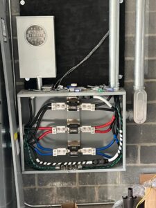 Installation of a commercial electrical distribution panel with heavy gauge wiring by D&M Master Electric LLC in Newark, NJ.