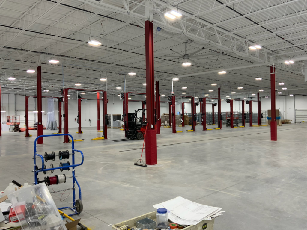 An expansive commercial electrical installation site with spools of wire and components by CM Armitage Electrical Contracting Inc in Rochester, NY.