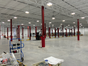 An expansive commercial electrical installation site with spools of wire and components by CM Armitage Electrical Contracting Inc in Rochester, NY.