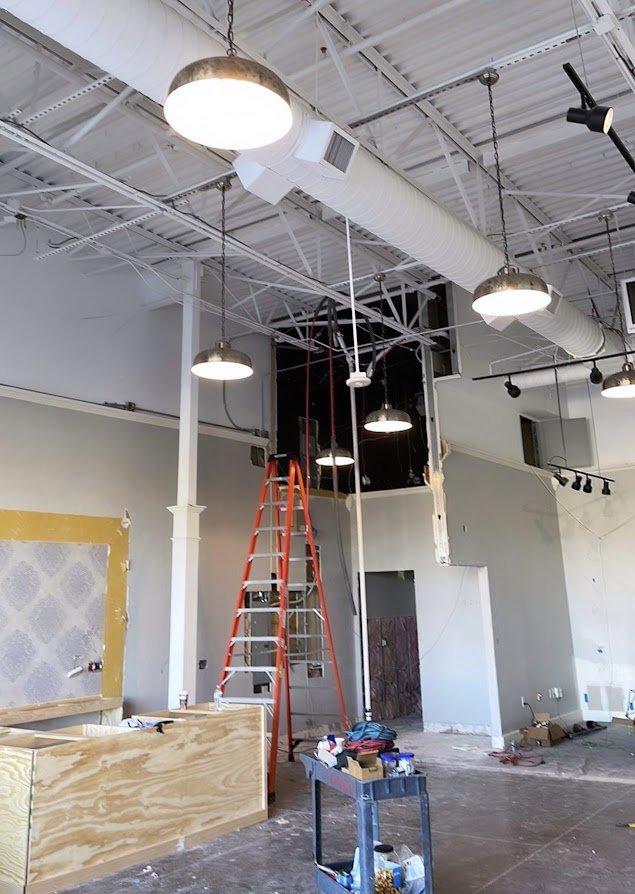 Commercial electrical and lighting installation in progress with exposed wiring and fixtures by Genesys Electrical Contractors in Dallas, TX