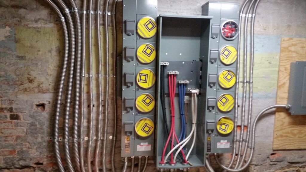 A commercial electrical meter bank installation with conduit and wiring by Gurley Electric LLC in Churchville, MD