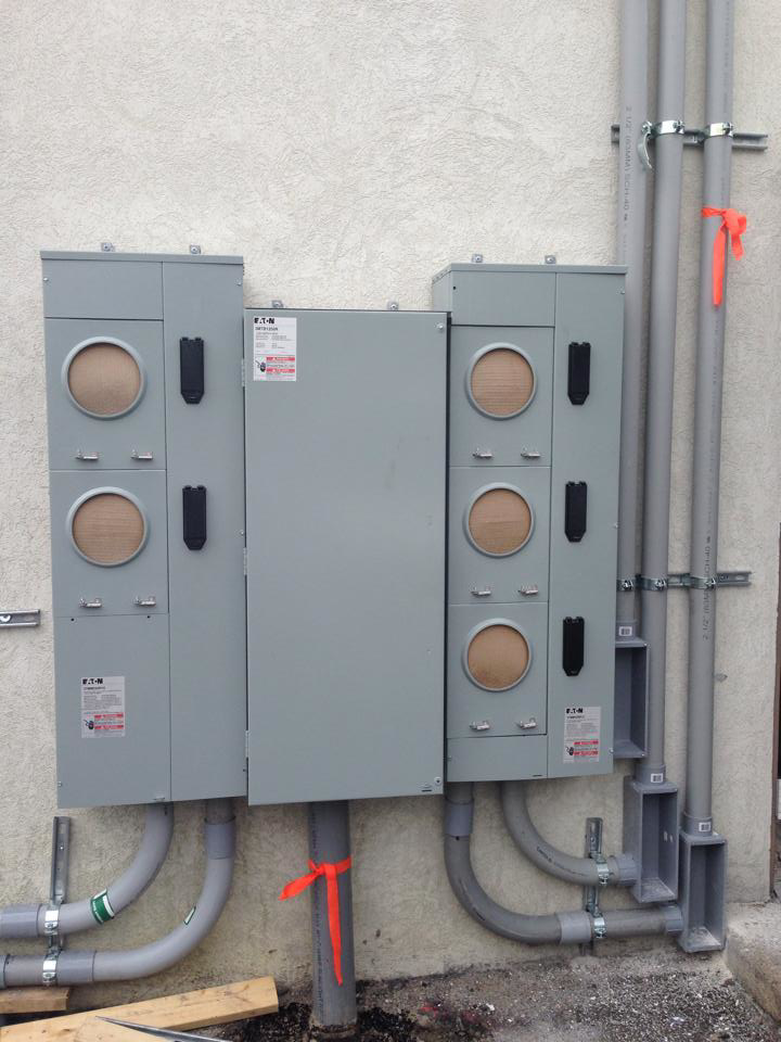 A commercial electrical meter and panel installation with multiple conduits by Bobby Burcher Electrical Inc. in Newport News, VA