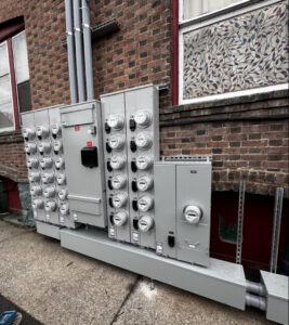 Large commercial electrical meter bases and panels installed on a brick building by kt_electricalcontractors in Spokane Valley, WA