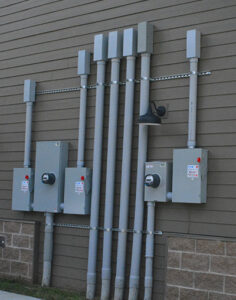 Commercial electrical meter and conduit installation on a building exterior by Pro 1 Electric, Inc. in Parkersburg, WV