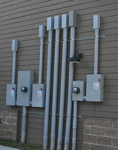 Commercial electrical meter and conduit installation on a building exterior by Pro 1 Electric, Inc. in Parkersburg, WV