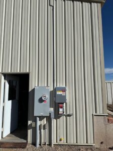 Exterior electrical meters and panels installed on a commercial building by Pueblo Electrics, Inc. in Pueblo, CO.
