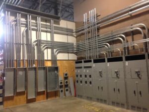 Large commercial electrical panel and conduit installation by Richard Sullivan Licensed Electrician in Brockton, MA.