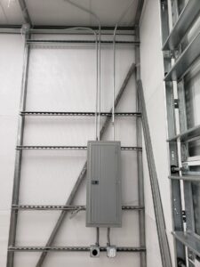 Commercial electrical panel and conduit installed on a metal frame by Everyday Electric in Tampa, FL.