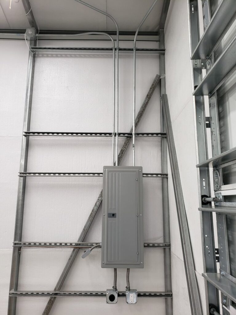 Commercial electrical panel and conduit installed on a metal frame by Everyday Electric in Tampa, FL.