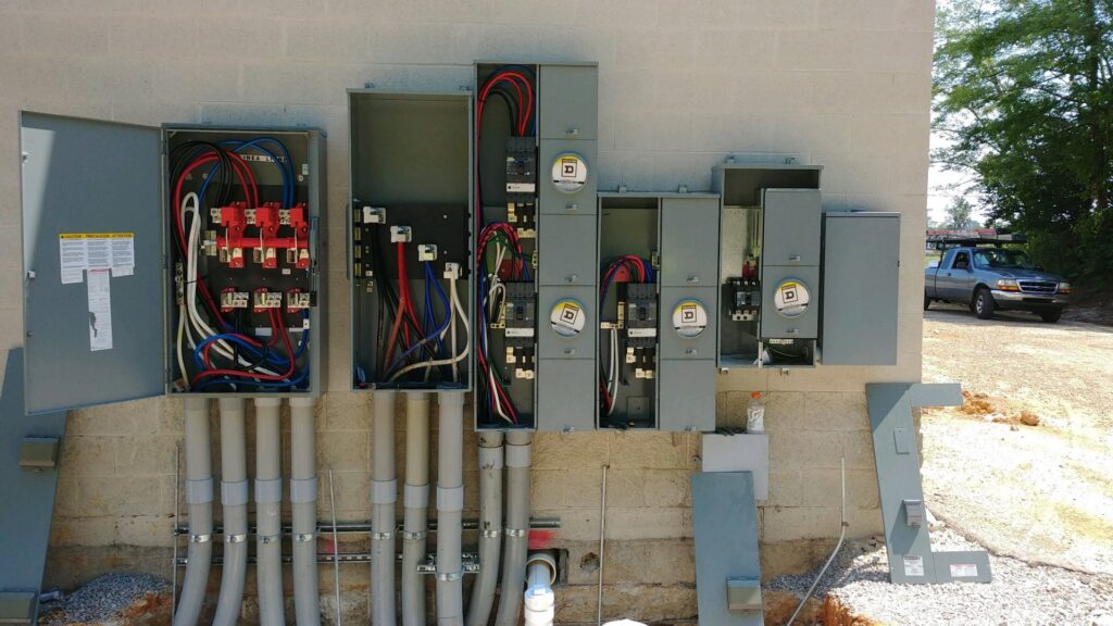 Multiple commercial electrical panels and conduits installed on a building by Discount Electrical Service of Franklin in Franklin, TN
