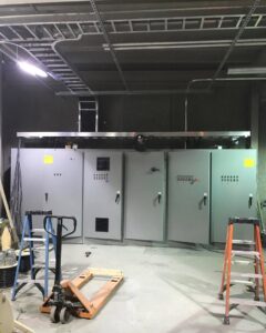 Large commercial electrical panels and cable trays installed by Progressive Electrical Services, Inc. in Lee, NH.
