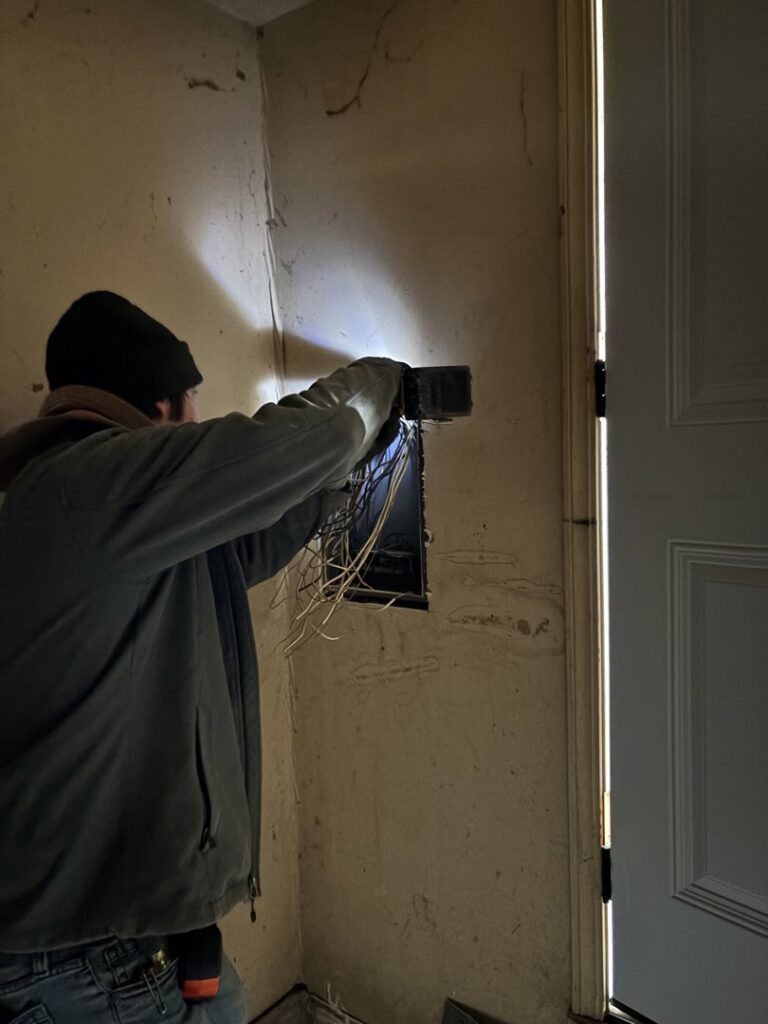Multiple electrical panels and meter installed on the exterior of a commercial building by Top notch electric llc in Clearwater, FL.
