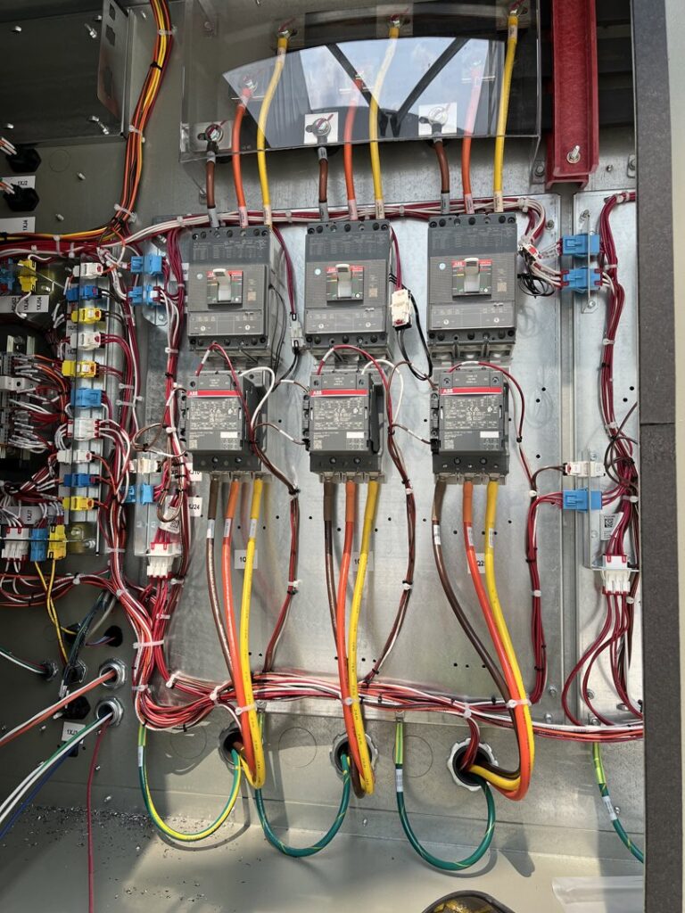 Detailed view of commercial electrical panel wiring and circuit breaker installation by Russell Electric LLC in Saint Clair, MI