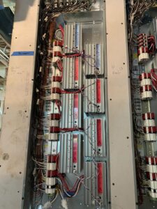 An open commercial electrical panel showing intricate wiring and components by Omni Electrical Services LLC in Philadelphia, PA.
