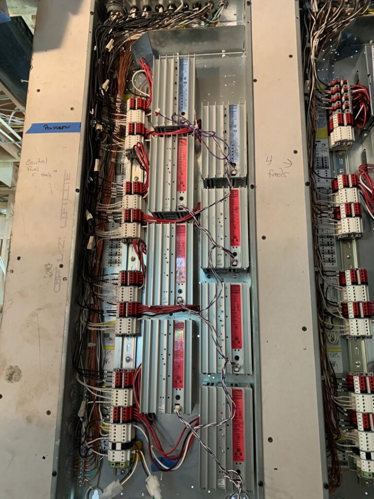 An open commercial electrical panel showing intricate wiring and components by Omni Electrical Services LLC in Philadelphia, PA.