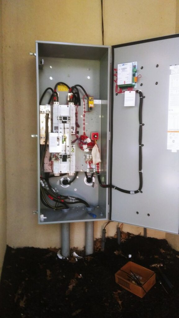 An open commercial electrical panel showing complex wiring and components installed by TCB Electric LLC in Elizabethtown, KY.