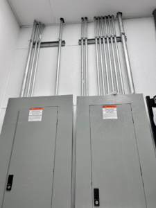 Commercial electrical panels and conduit installed for a business by Solution Electric in Houston, TX.
