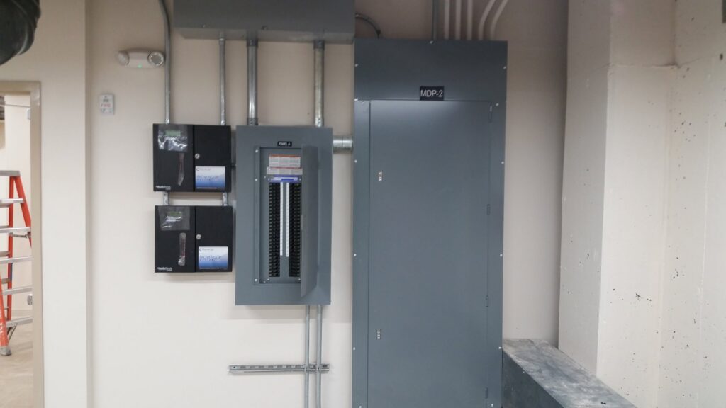 Commercial electrical panels and meters installed on a wall by Babcon Electric Inc. in Richmond, KY