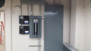 Commercial electrical panels and meters installed on a wall by Babcon Electric Inc. in Richmond, KY