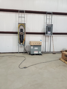 Commercial electrical panels and a transformer installed by Overton Power Solutions Electric in Hephzibah, GA