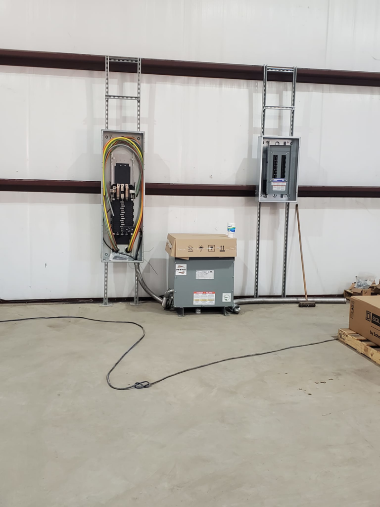 Commercial electrical panels and a transformer installed by Overton Power Solutions Electric in Hephzibah, GA