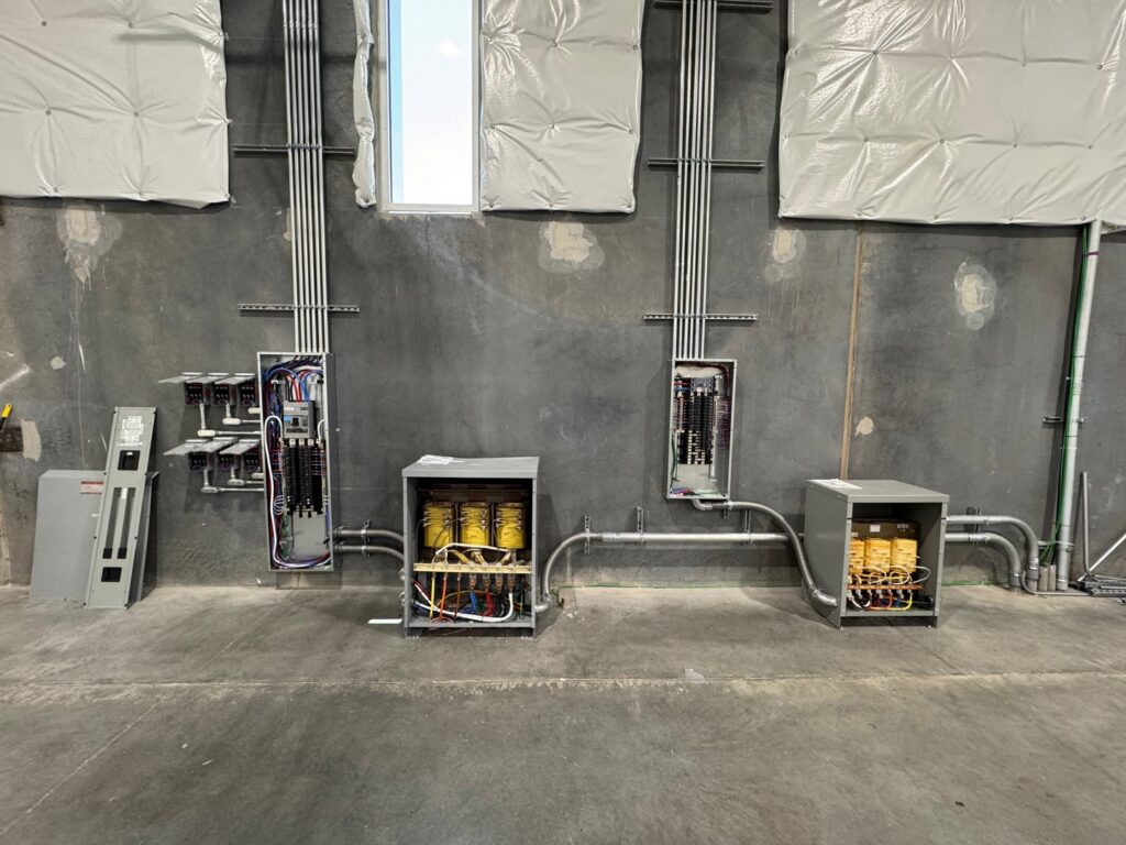 Extensive commercial electrical installation featuring multiple panels, transformers, and conduit by Industrial Edge Electrical in Gilbert, AZ.