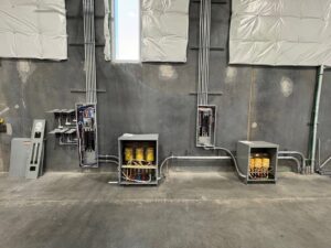 Extensive commercial electrical installation featuring multiple panels, transformers, and conduit by Industrial Edge Electrical in Gilbert, AZ.