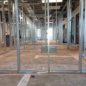 Electrical rough-in work with conduit boxes in a commercial building under construction by Ozzy Electric in Jacksonville, FL.
