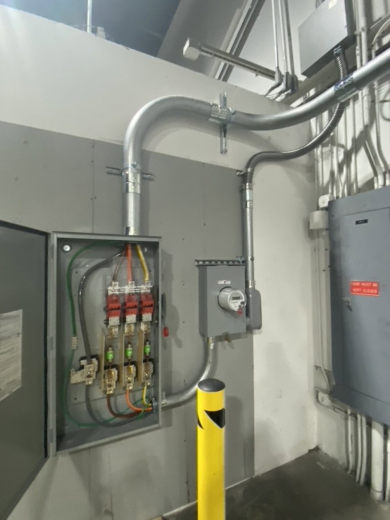 Commercial electrical service upgrade with open panel and meter by Empower Electrical, LLC in Fall River, MA