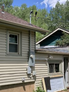 A large commercial electrical transformer installed in the snow by AMG Electric LLC Laramie, WY.