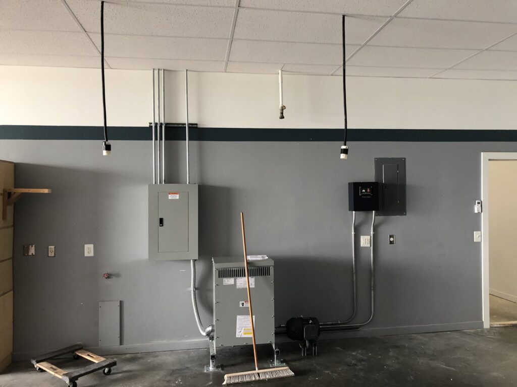 Commercial electrical transformer, panels, and conduit installed by Erbert Electric in Overland Park, KS