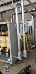 Commercial electrical transformer and panel board installation by Julio A Lopez Electrician in Lowell, MA.