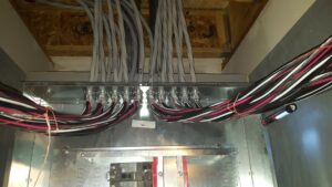 Detailed view of commercial electrical wiring and panel connections by Icon West Corporation Electrical Contractors in Springfield, MA.