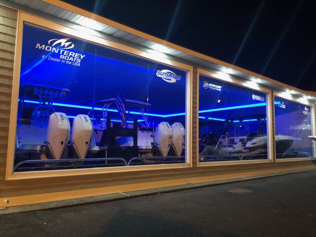 Commercial building exterior at night with vibrant blue accent lighting installed by RTF Electric LLC in Toms River, NJ.