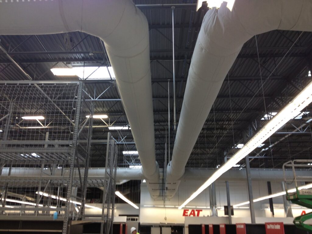 Large fabric ductwork installed in the ceiling of a commercial building, a project completed by ACI Northwest Heating, Cooling & Electrical in Dalton Gardens, ID.