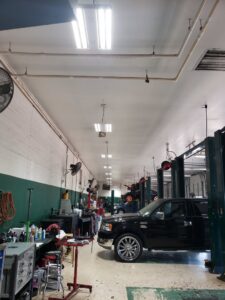 Commercial fluorescent lighting in an auto repair shop installed by Superior Electric and Lighting LLC in Southaven, MS